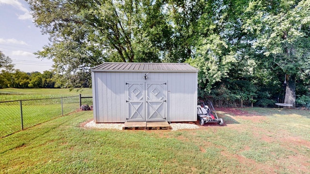 view of outdoor structure with a yard