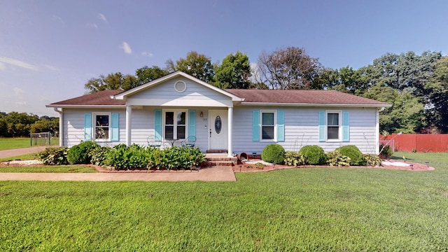 single story home with a front lawn