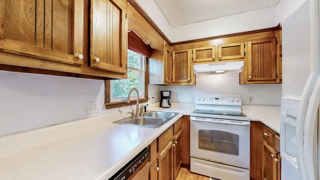 kitchen with white appliances and sink