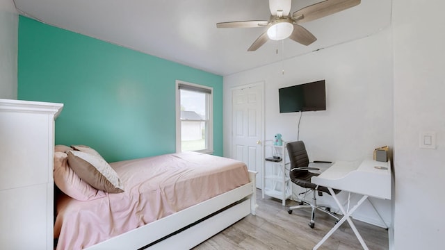 bedroom featuring ceiling fan and light hardwood / wood-style flooring