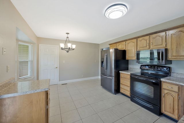 kitchen with a notable chandelier, hanging light fixtures, light tile floors, and stainless steel appliances