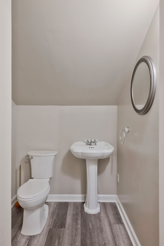 bathroom featuring toilet and hardwood / wood-style flooring