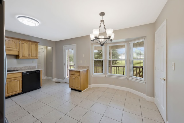 kitchen with dishwasher, a wealth of natural light, light tile floors, and pendant lighting