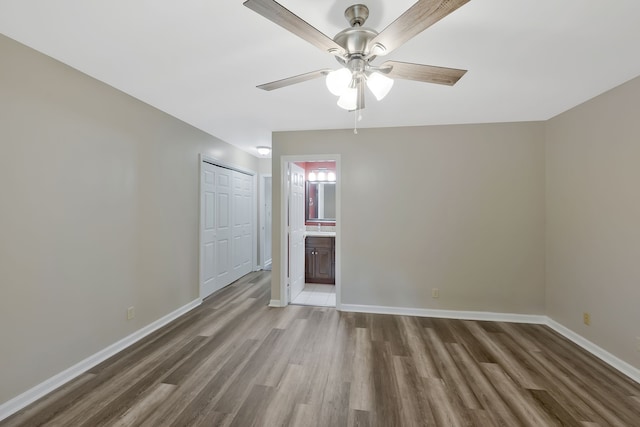 spare room with ceiling fan and hardwood / wood-style floors