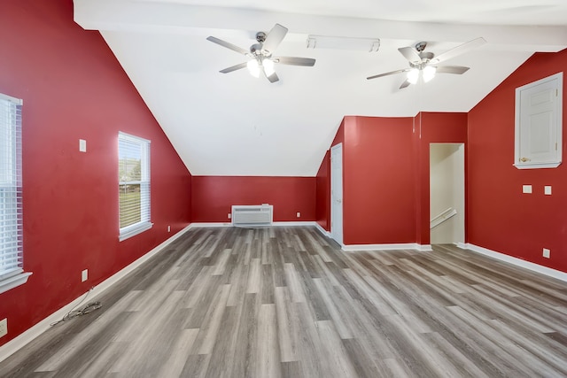 bonus room featuring ceiling fan, vaulted ceiling, and wood-type flooring