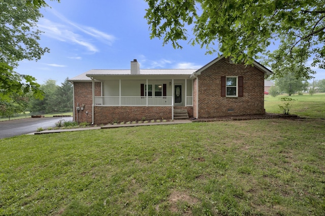 ranch-style house with a front lawn and covered porch