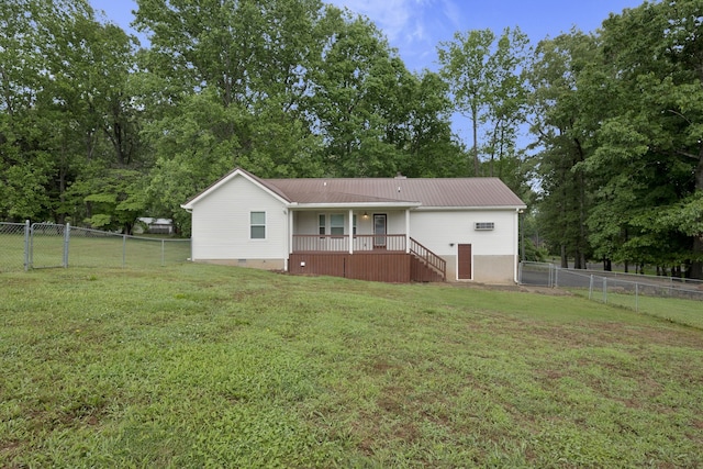 rear view of property with a yard and covered porch