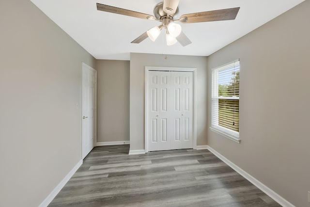 unfurnished bedroom featuring ceiling fan and hardwood / wood-style floors