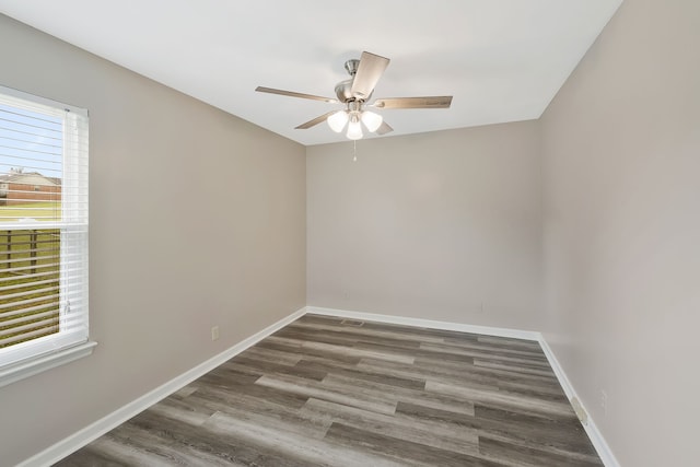 empty room with ceiling fan and hardwood / wood-style flooring