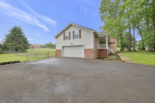 view of front facade featuring a garage and a front lawn