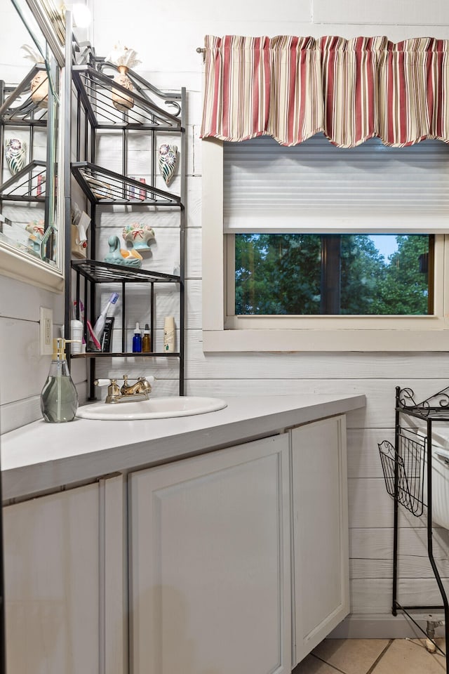 interior space with light tile patterned floors and a sink