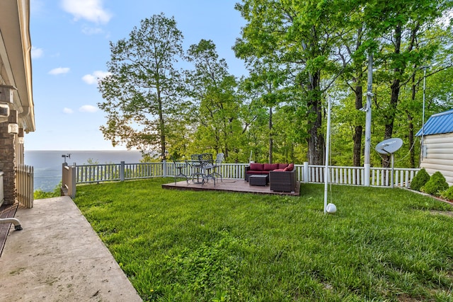 view of yard with a patio area, a water view, a fenced backyard, and an outdoor hangout area