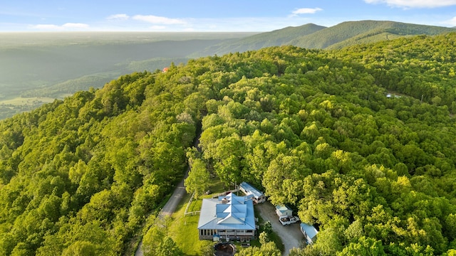 bird's eye view with a mountain view and a wooded view