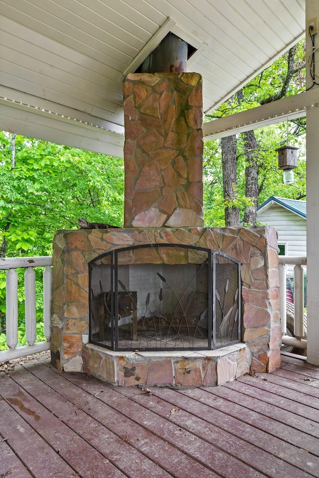 exterior details with an outdoor stone fireplace