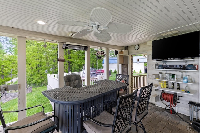 view of patio / terrace featuring outdoor dry bar and ceiling fan