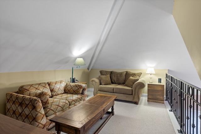 carpeted living room featuring lofted ceiling with beams