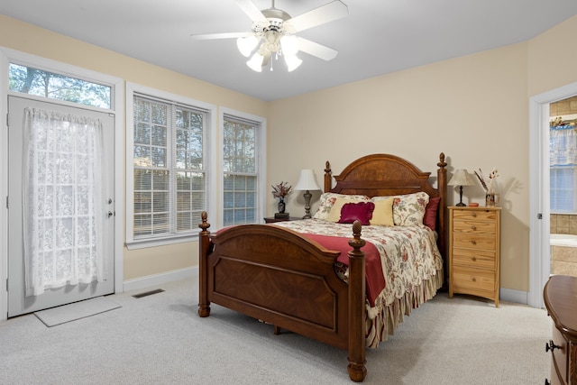 carpeted bedroom featuring connected bathroom and ceiling fan