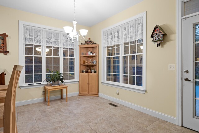 dining space featuring an inviting chandelier