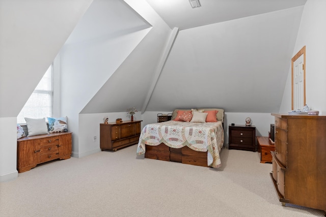 carpeted bedroom with vaulted ceiling