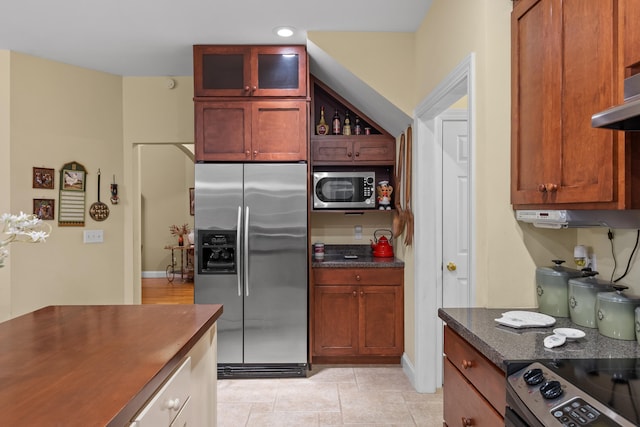 kitchen featuring appliances with stainless steel finishes and light tile patterned flooring