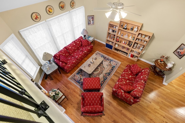 living room featuring hardwood / wood-style flooring and ceiling fan