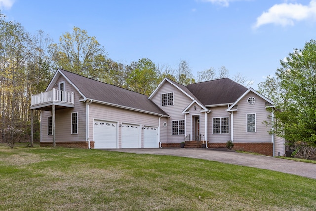 view of front property with a balcony, a front lawn, and a garage