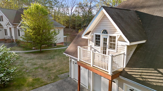 exterior space with a yard and a garage