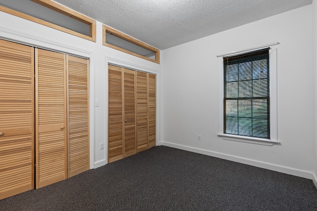 unfurnished bedroom featuring a closet, a textured ceiling, and carpet floors