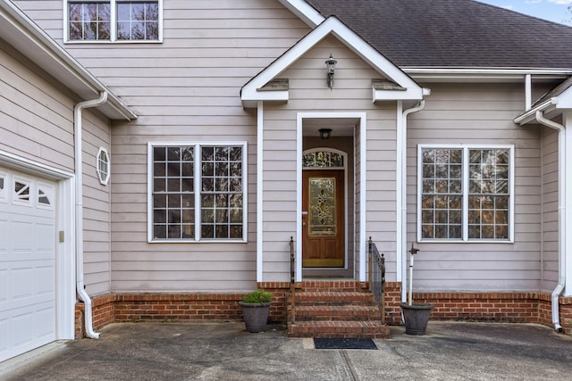 property entrance with a garage