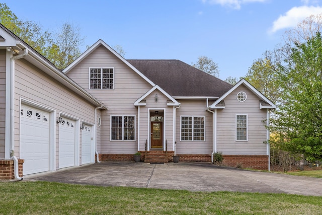 view of front of house with a front lawn and a garage