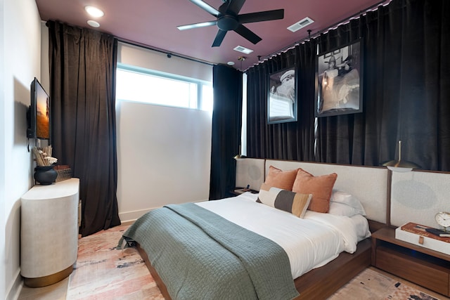 bedroom featuring light wood-type flooring and ceiling fan