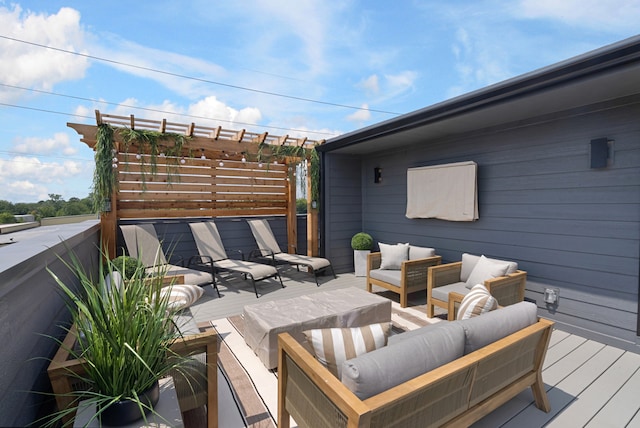 deck featuring a pergola and an outdoor hangout area