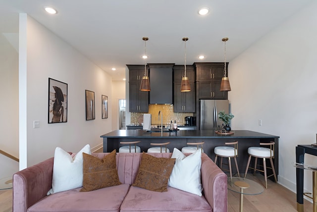 interior space with sink and light hardwood / wood-style floors