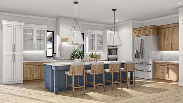 kitchen with a center island, stainless steel appliances, light hardwood / wood-style floors, and backsplash