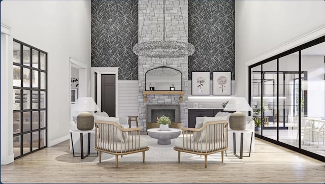 living room with a high ceiling, a fireplace, and light wood-type flooring