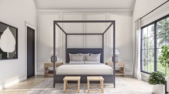 bedroom featuring ornamental molding and light hardwood / wood-style flooring