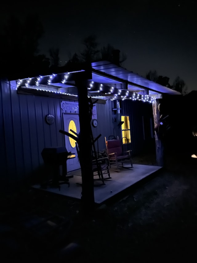 view of patio terrace at night