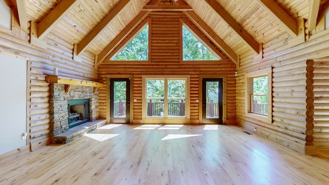 unfurnished living room featuring high vaulted ceiling, wooden ceiling, rustic walls, and light hardwood / wood-style flooring