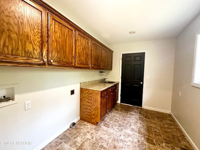 kitchen with light tile patterned floors and sink