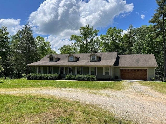 view of front of home with a front lawn and a garage