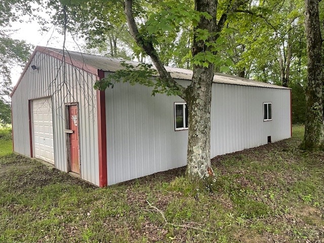 view of outbuilding featuring a garage