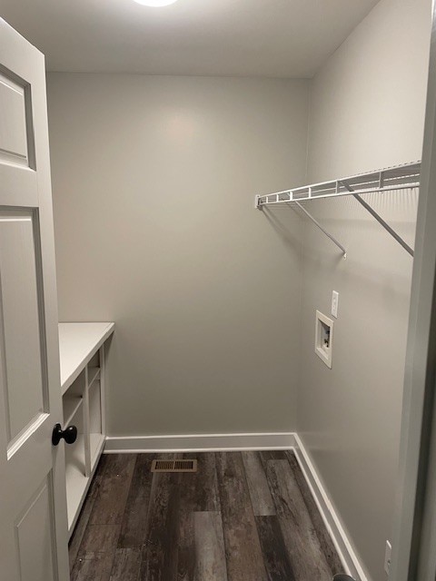 laundry area with washer hookup and dark hardwood / wood-style floors