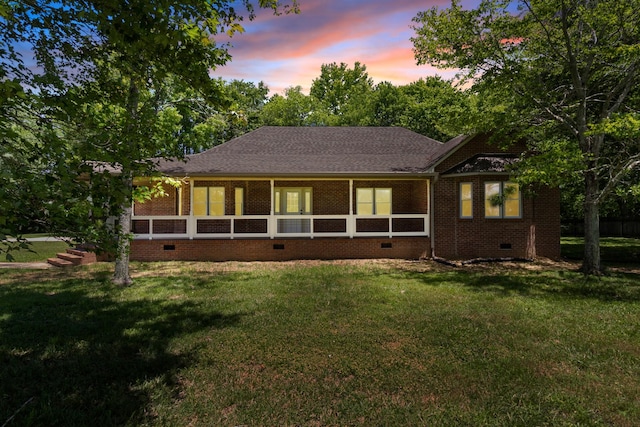 view of front of property with a yard