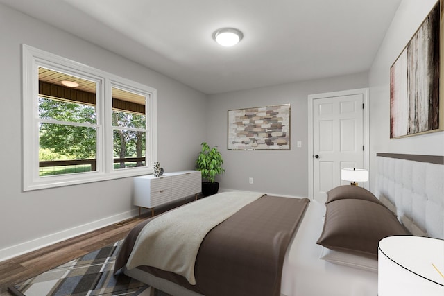 bedroom with wood-type flooring