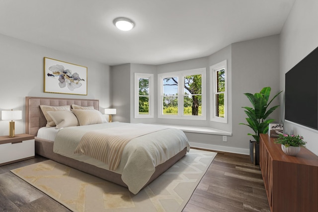 bedroom featuring dark hardwood / wood-style flooring