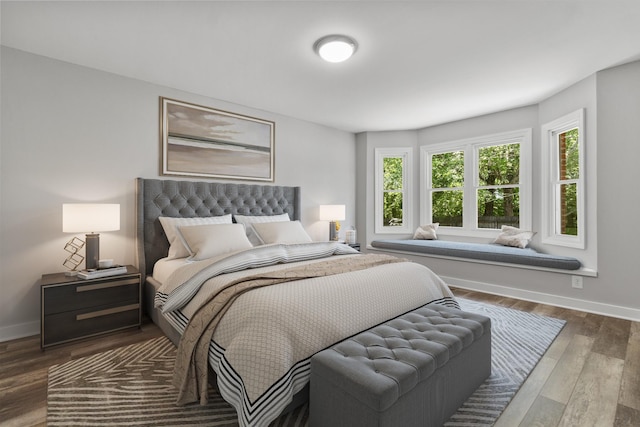 bedroom with hardwood / wood-style flooring