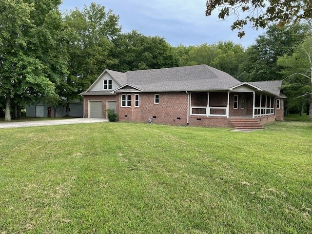 ranch-style house featuring a garage and a front lawn