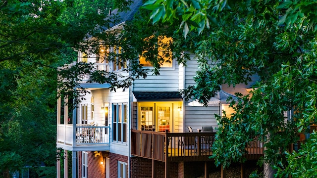 back of property featuring a wooden deck