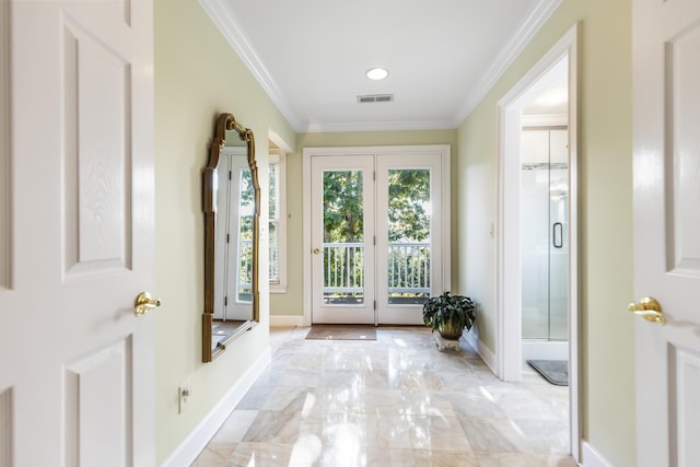 foyer entrance with crown molding and light tile flooring