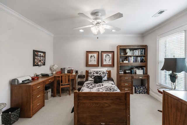 carpeted bedroom featuring ceiling fan and crown molding